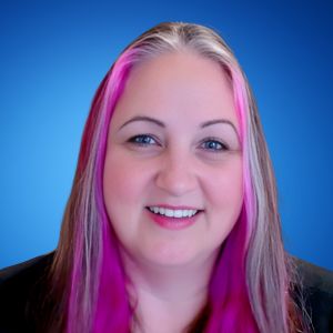 A photograph of Melanie Schlotterbeck against a blue background.