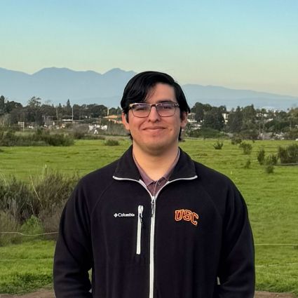 A photograph of David Martinez outside.