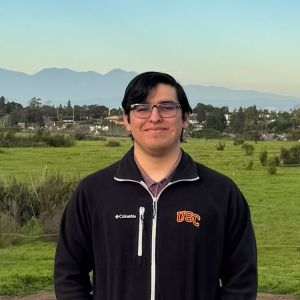 A photograph of David Martinez outside.